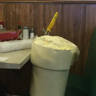 This tub of "spread" (not real butter) was sitting, uncovered and unattended on a booth. This is not s good look. I won't be back.