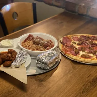 Boneless Chicken Wings, Spaghetti w bread, and Meat Lovers Pizza