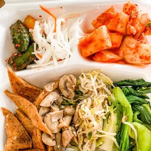 a tray of asian food