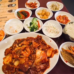 Entree is the Pork and Kimchee Sauté presented with 10 banchan dishes and a bowl of rice.