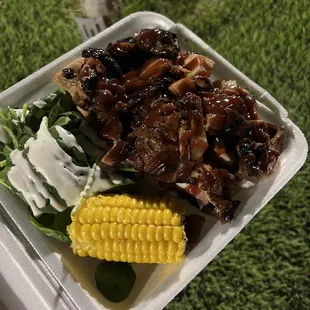 BBQ chicken in a bed of rice, spinach &amp; corn on cob