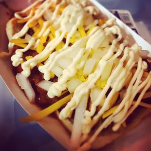 Airborne Dog:
100% Beef Dog with Homemade Chili/Onions/Cheese/House Sauce)