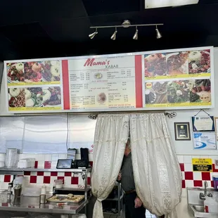 a man standing in front of a menu
