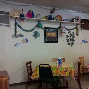 a dining room with a table and chairs