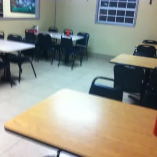 a dining room with tables and chairs