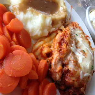 a plate of food with carrots and mashed potatoes