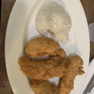 Delicious chicken strips, mashed potatoes and white gravy!