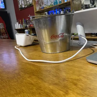 a bucket of coke on a counter