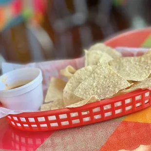 a basket of chips and a cup of coffee