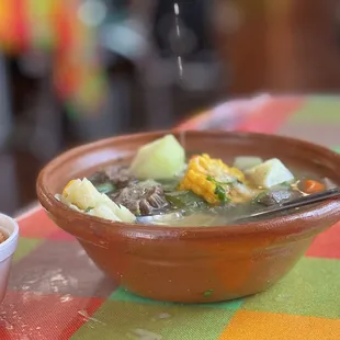 a bowl of soup and a bowl of rice