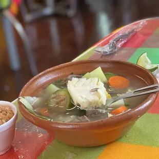 a bowl of soup and a bowl of rice