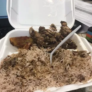 a tray of rice and meat