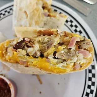 a breakfast burrito on a plate