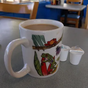 a cup of coffee on a table