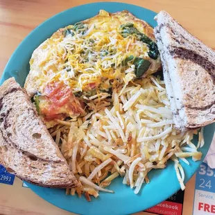 Spinach and tomato omelet, homefries and rye toast.
