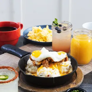 Loaded Biscuit Skillet 
at Mama's! Fluffy bacon biscuits, scrambled eggs, Mama's fried chicken,  cheddar, bacon,
onions, country gravy