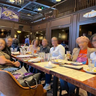 a group of people sitting at a table