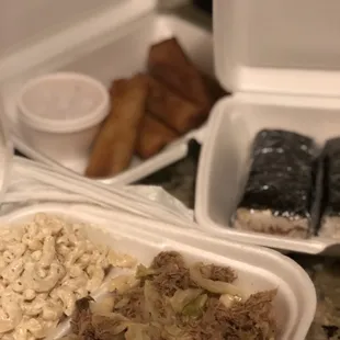 Kalua egg roll, spam musubi, kalua pork plate.