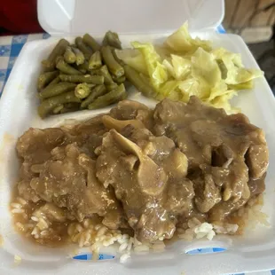 Oxtails with rice, green beans and cabbage