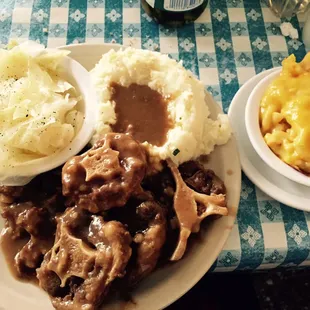 Oxtail Combo Plate w/ cabbage, mashed potatoes, and mac &apos;n cheese! Comes with 3 sides.