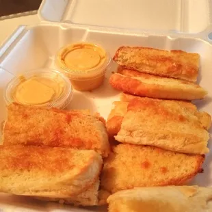 Bread sticks and cheese sauce