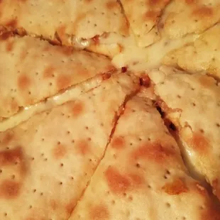 a pizza cut into eight pieces