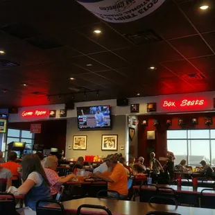 The silverware and other amenities for customers directly beneath the TV.