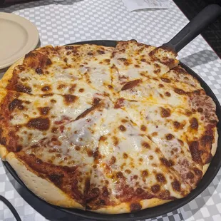 Medium pepperoni. Perfect size for 2 ppl. Pepperoni is baked under the cheese. Delish!