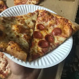 Slice from a large cheese and pepperoni extra crispy
