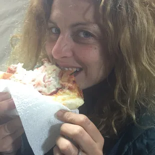 A real life Italian enjoying Mama's pizza