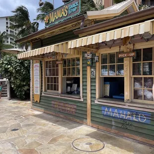 a woman standing in front of a restaurant