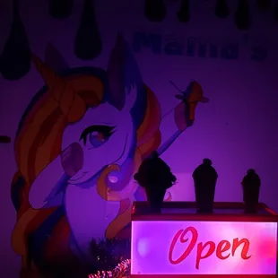 a neon sign for an ice cream parlor