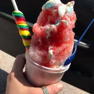 a person holding a cup of ice