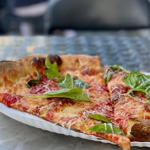 "House slice" aka plain slice with basil and grated Parmesan.  $4 each