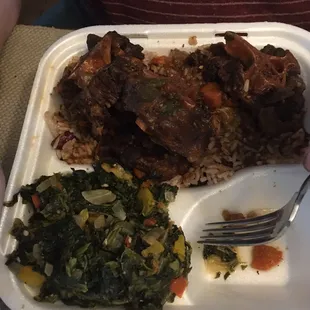 Oxtails with rice &amp; peas, spicy spinach side.