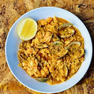 a bowl of food on a wooden table