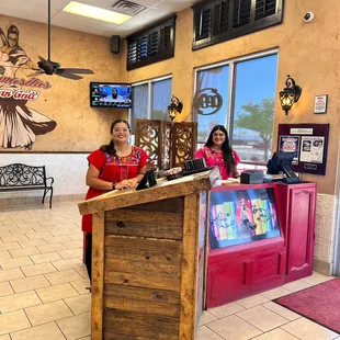Our hostess' ready to greet your with a smile.