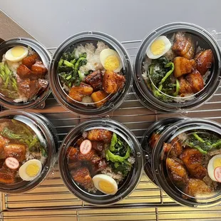 six containers of food on a rack