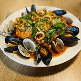 Seafood Arrabbiata. - Homemade tagliatelle shrimp, calamari, clams, mussels, and shrimp