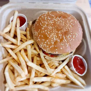 Double cheeseburger and fries made simply with mayo and ketchup