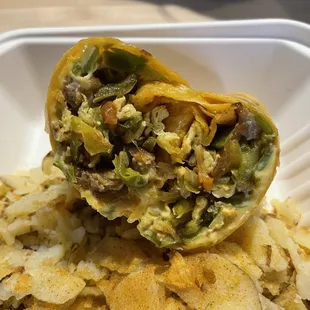 Breakfast burrito - jalapeño wrap, peppers, onions, jalapeños, sausage, cheese. Excellent!