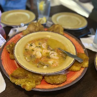 a bowl of shrimp and grits