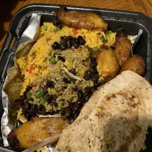 Arroz con Pollo with sweet plantain and black beans