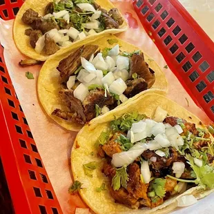 Carne asada, carnitas and Al pastor tacos that my wife ordered. Served with white corn tortillas. Thank goodness!