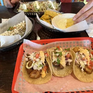 Baja Fish Tacos, street corn, fresh queso and street tacos