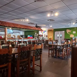 a dining area with tables and chairs