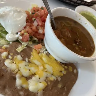 Refried beans, charro beans,pico de Gallo, sour cream and salsa verde
