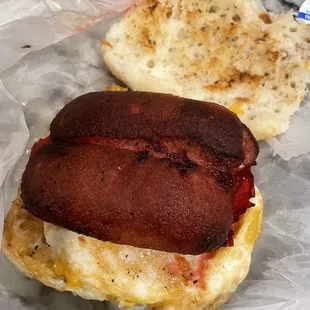 Red link with fried egg and cheese biscuit