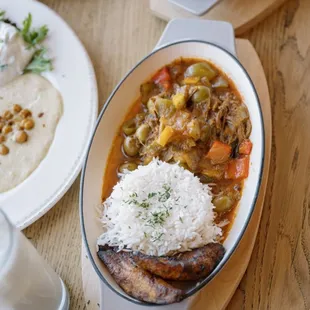 Classic Ropa Vieja stew served with carmalized plantains white rice black beans