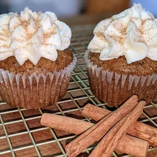 two cupcakes on a cooling rack